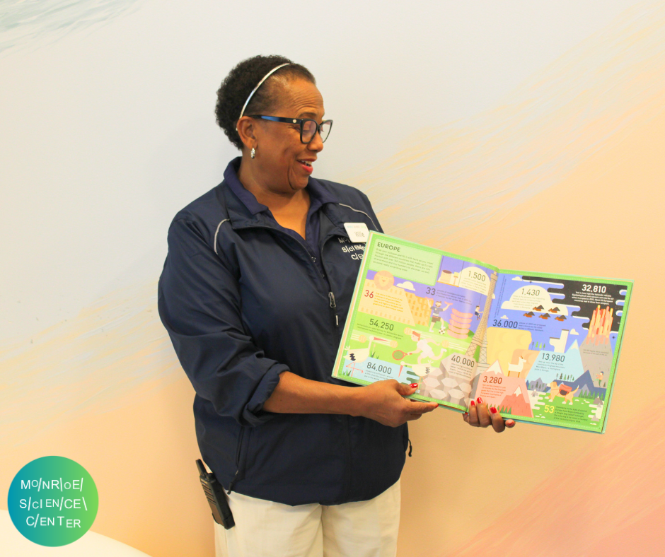 A Monroe Science Center staffer reads a picture book.